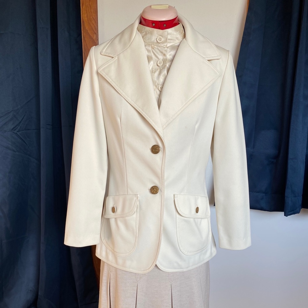 Vintage 80s white brazed with gold buttons.